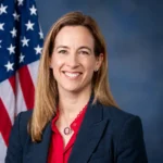 Mikie Sherrill net worth 2026 biography portrait with U.S. flag