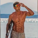 Hrithik Roshan biography featured image showing the Bollywood actor at a beach